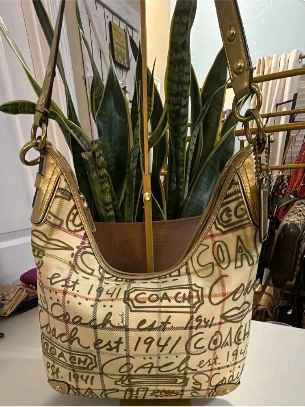 Coach Cream Canvas Shoulder Bag with Gold Accents and Script Print